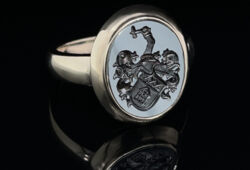 Whitegoldring, set with a hematite including coat of arms engraving
